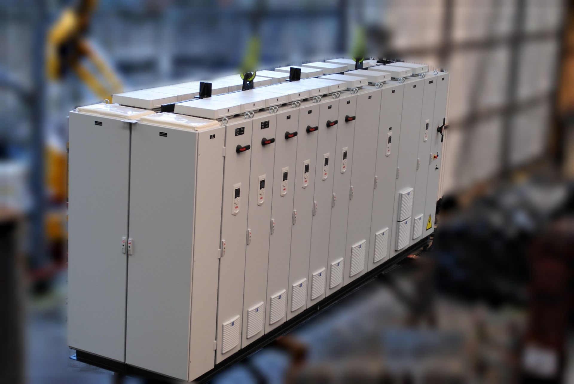 Row of power switchboards with ABB frequency drives, built by TD2E